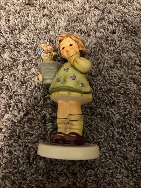 Hummel Girl Figurine in Yellow Dress Holding Flower Pot